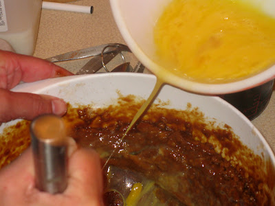 Slowing whisk beaten eggs into batter