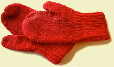 Bright red pair of handknit mittens