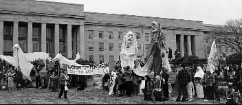 Black and white photo of large puppets at the doors of the Pentagon