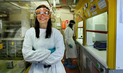 Nicole Kuepper in goggles and gown in her lab