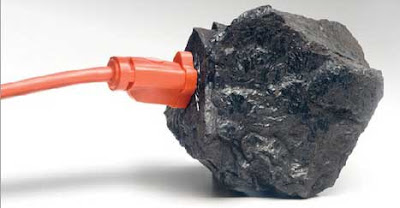A chunk of coal with an orange extension cord plugged into it