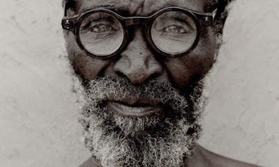Zulu man wearing glasses with thick, circular-shaped glasses