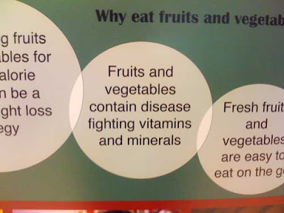Photo of part of poster, reading Fruits and vegetables contain disease (line break) fighting vitamins and minerals