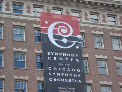 Chicago Symphony Orchestra logo, a large C set against five horizontal lines with some dots around it