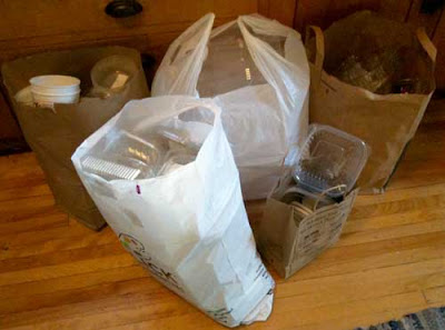 Four large bags and one small bag full of plastic containers
