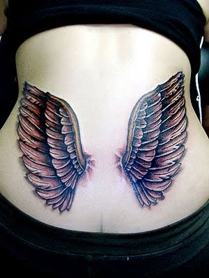 Small wings tattoo design on lowerback tattoos for girls