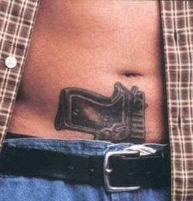 Gun tattoos are often seen as a tough symbol.