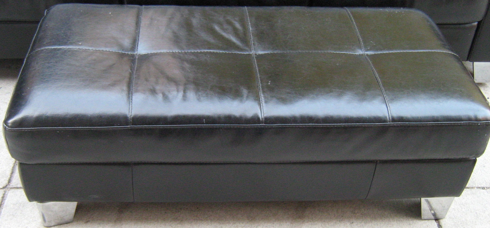[black+leather+ottoman.jpg]