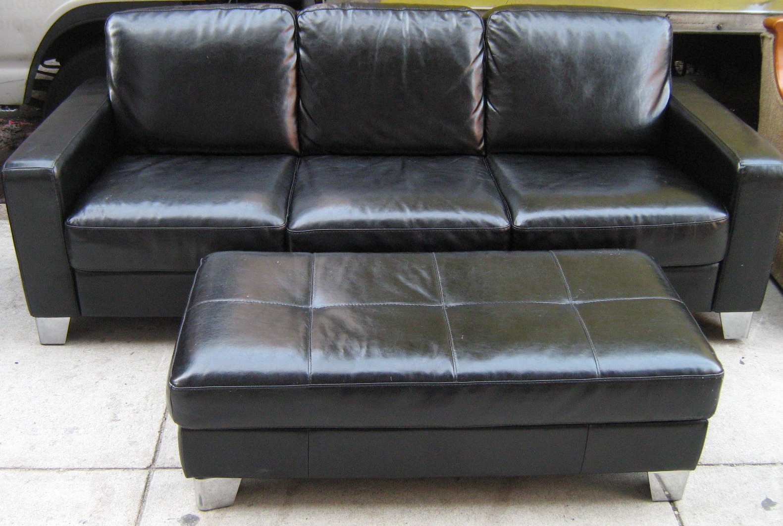 [black+leather+couch+and+ottoman.jpg]