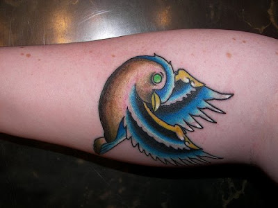 Great looking sparrow tattoo. With a hint of gold and blue i love this 