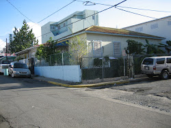 TWO WOODEN HOUSES WITH TIN ROOF