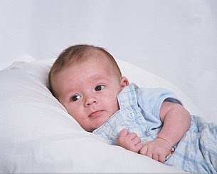 American Baby sleep on the bed stills