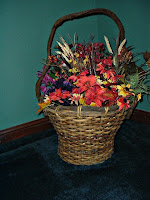 Flower basket with wooden handle --this is the one hiding the coiled TV cable