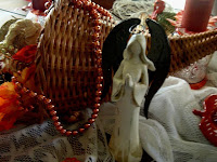 The backside of the cornucopia with a 'faceless' white bisque angel
