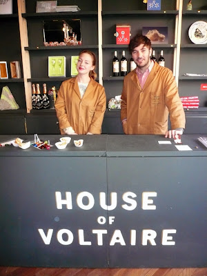 Art and design celebrities don the House of Voltaire work coat for their shift as shopkeeper for the day. Image courtesy Studio Voltaire.