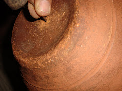 Making a hole in the pot with a nail
