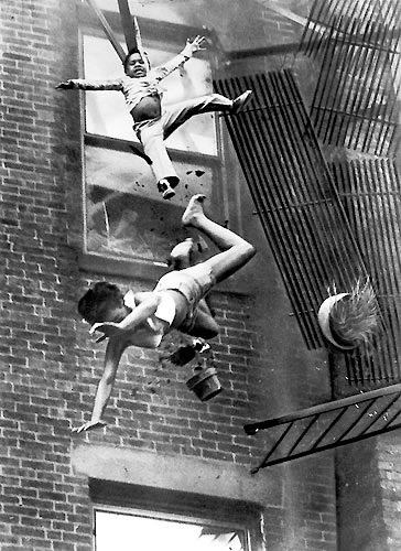 A woman and a girl falling down after the fire escape collapses.