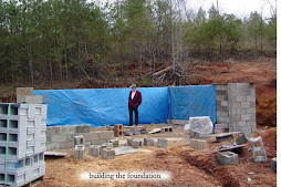 Joe standing at the foundation underconstruction