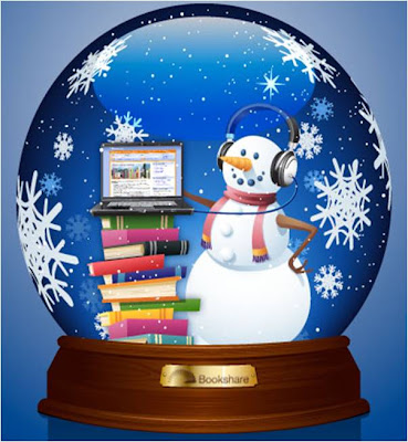 Snow globe with snowman, stack of books and laptop displaying Bookshare