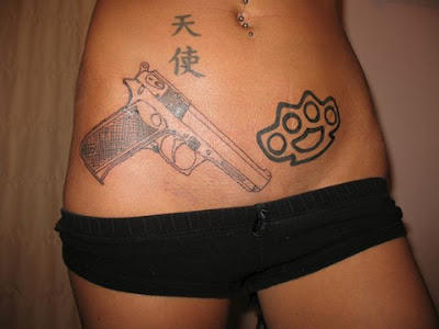 gun tattoos. There are her new gun tattoos!