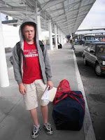 camper at airport with duffle