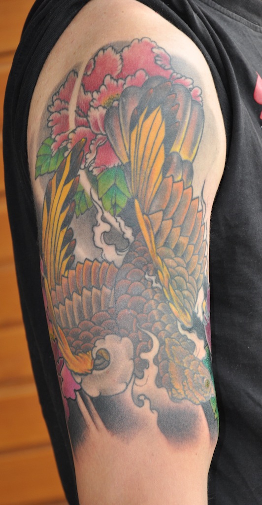 awesome robot tattoos. more flowers to his falcon/hawk piece.