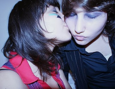bisou! by madefortvmovies @ Flickr.com. One woman kisses another woman's cheek.