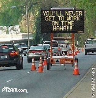 electronic road sign that taunts people that they will not get to work on time