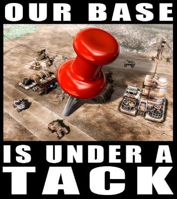 cartoon of a giant tack stuck in the middle of a base and the caption reads our base is under a tack
