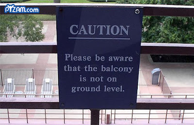 photo of a funny sign on a balcony