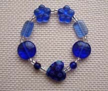 7" Multi-Shaped Blue Glass Bead Bracelet $25.00