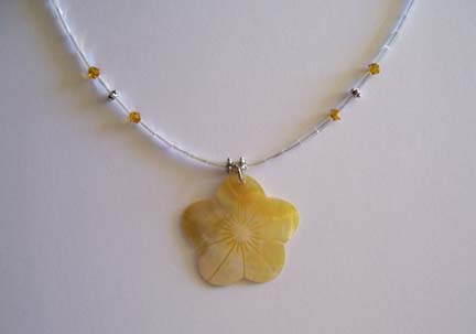 Etched Yellow Shell Flower Pendant Necklace (close-up)