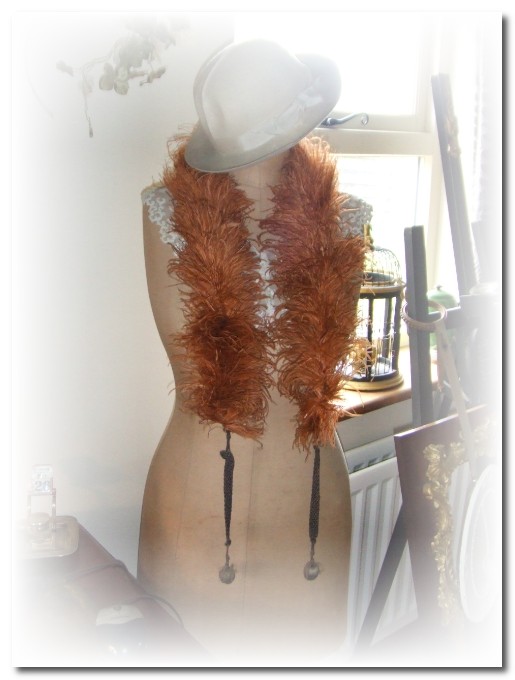 mannequin with feather boa and hat mannequin with feather boa and hat