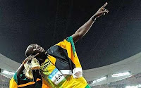 Le signe de Usain Bolt apres avoir gagner la course