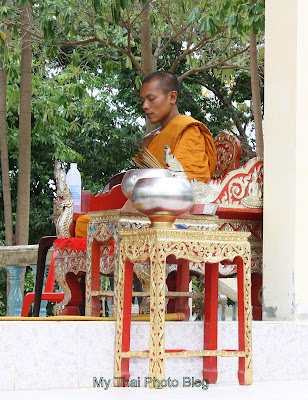 Buddhist Monk Blessing with holy water