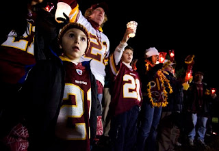 5-year-old Andrew Duncan attends a candlelight vigil for Sean Taylor