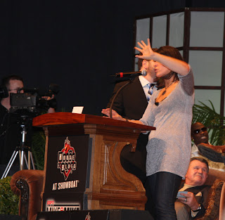 Jeffrey Ross pulling Dana Jacobson off stage