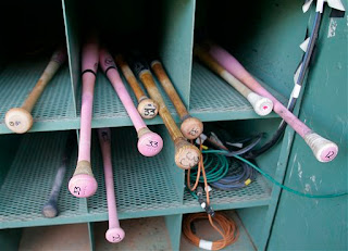 pink bats in the bat rack
