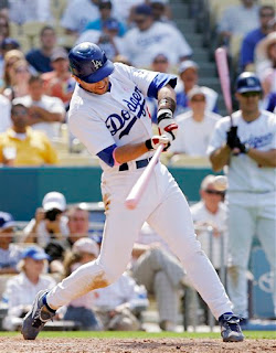 I threw this picture in for Juice, Nomar used a pink bat to get two hits and honor is wife and new mama, Mia Hamm