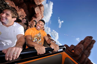 Chris Cooley and Jason Campbell sit together, with Christy and Mercedes behind them
