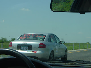 Looking through the windshield of John and Rachel's car at another car in the caravan from Dallas, somewhere on Southbound I-35