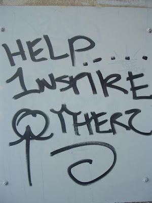 the words Help Inspire Others as graffiti on wall the words Help Inspire Others as graffiti on wall