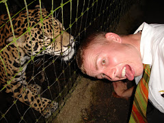 Elder Armstrong being licked by a jaguar
