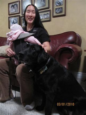 Elaine Harrison with Guide Carmel and baby daughter