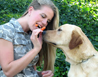 Sierra pictured sharing carrots with Blakely, a Labrador Retriever/Golden Retriever crossbreed