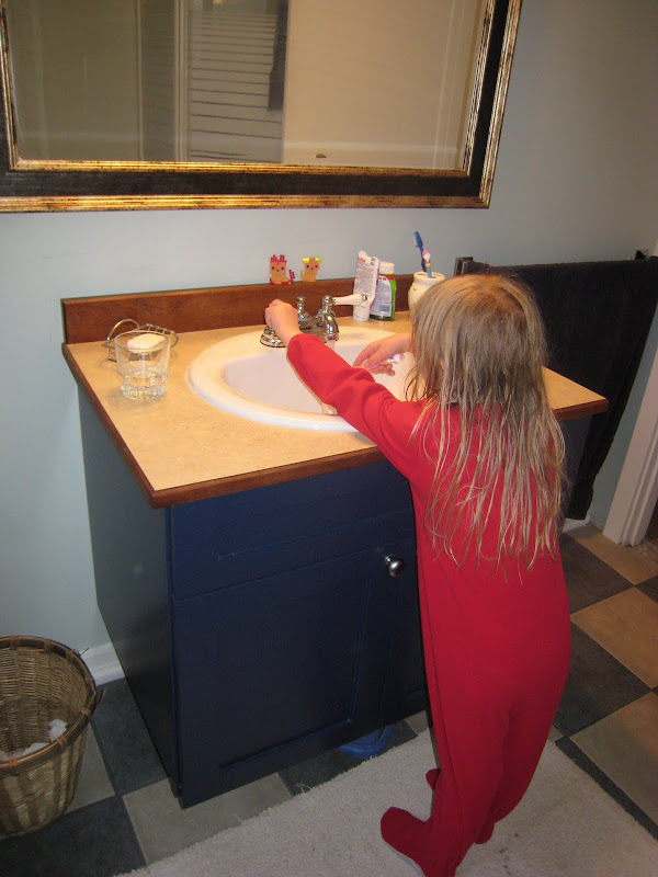 The vanity in their part of the bathroom was installed lower, so K title=