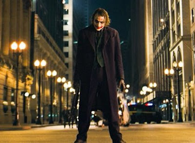 The Joker wonders, 'How does Batman get all those wonderful toys when the economy's in the crapper?'