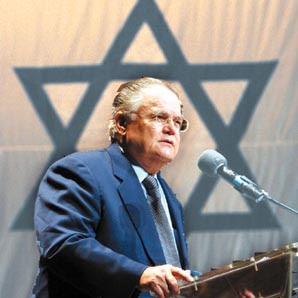 Hagee before Israeli flag