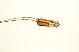 pendant made of a crystal and a bullet casing