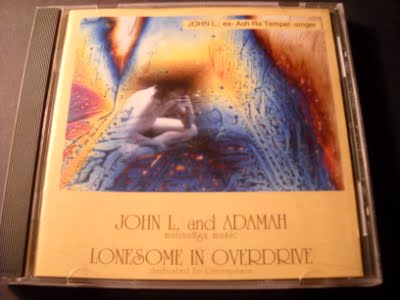 [John+L.+and+Adamah-Lonesome+In+Overdrive-front+copy.JPG]